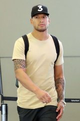 A dejected Israel Folau leaves Sydney. His $4 million rugby contract has been torn up.