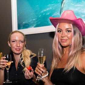 Emma Lavington (Left) and Felicia Wallton pampered themselves with a spray tan and champagne at Tan Temple ahead of Mardi Gras Parade.