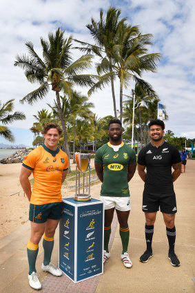 Michael Hooper of the Wallabies, Siya Kolisi of the Springboks and Ardie Savea of the All Blacks pose with the Rugby Championship trophy .