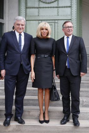 Francois-Henri Pinault, CEO of luxury group Kering, left, Brigitte Macron wife of French President Emmanuel Macron, center, and Bruno Pavlovsky president of Chanel arrive at the event.