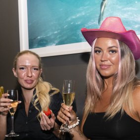 Emma Lavington (Left) and Felicia Wallton pampered themselves with a spray tan and champagne at Tan Temple ahead of Mardi Gras Parade.