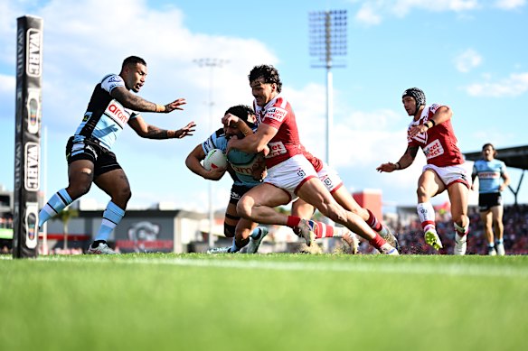 Herbie Farnworth tries to deny Cronulla during the 66-0 loss at home.
