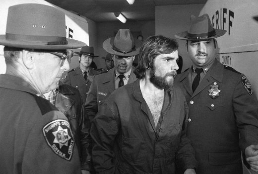  Ronald DeFeo Jr., centre, leaves Suffolk County district court after a hearing, on New York’s Long Island. DeFeo was convicted of slaughtering his parents and four siblings in a home that later inspired the book and movie “The Amityville Horror”. 