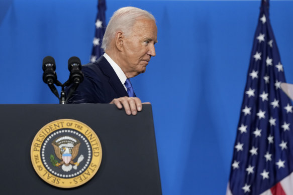 US President Joe Biden departs after speaking at the news conference. 