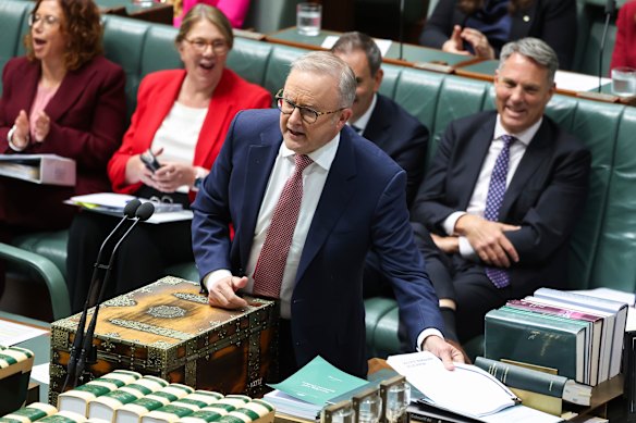 Albanese tables the review during question time, to laughter from the Labor frontbench.