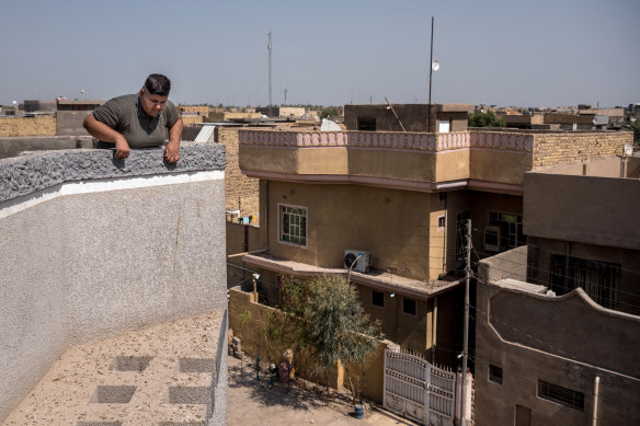 Ali Adil on the roof of his family home in Hilla, south of Baghdad, where he now faces threat of violence after his appeal to Joe Biden.  