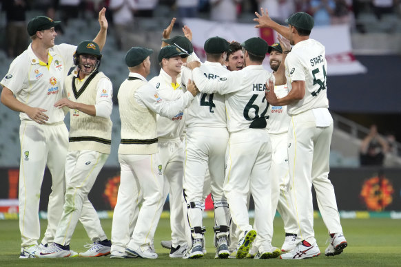 Australia’s players celebrate the final wicket in Adelaide. 
