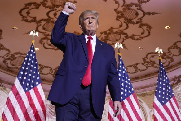 Former US president Donald Trump gestures after announcing he is running for the White House for the third time.