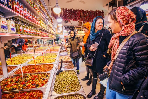Shopping at a local market in Tehran on one of Intrepid’s women-only tours of Iran.