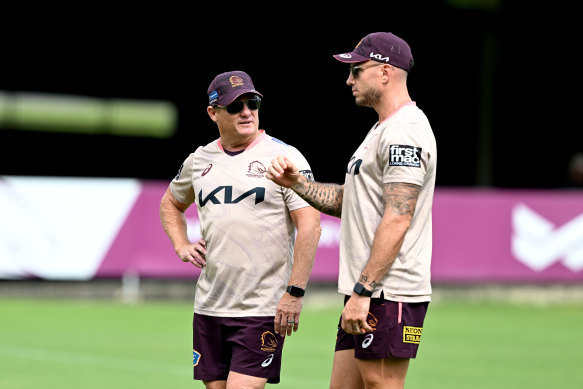 Coach Kevin Walters chats during training with Darius Boyd, who has been employed by the Broncos on a part-time basis to coach the fullbacks, wingers and centres.