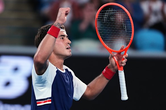 Francisco Comesana of Argentina reacts after winning the third set against Frances Tiafoe.