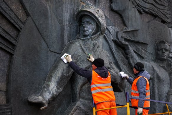 A bas-relief of Yuri Gagarin, the first person who flew to space, is cleaned ahead of Cosmonautics Day, which this year marks the 60th anniversary of Gagarin’s pioneering mission on April 12 1961.