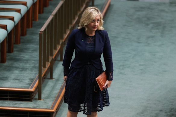 Melissa McIntosh leaves the chamber.