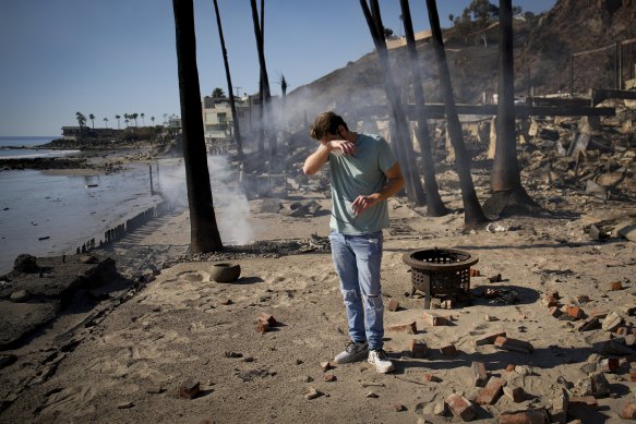 Luke Dexter among the remains of his father’s fire-ravaged Malibu beachfront property in the aftermath of the Palisades fire.