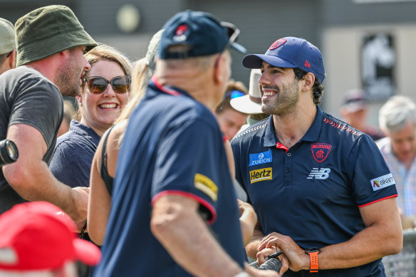 Petracca speaks to fans.