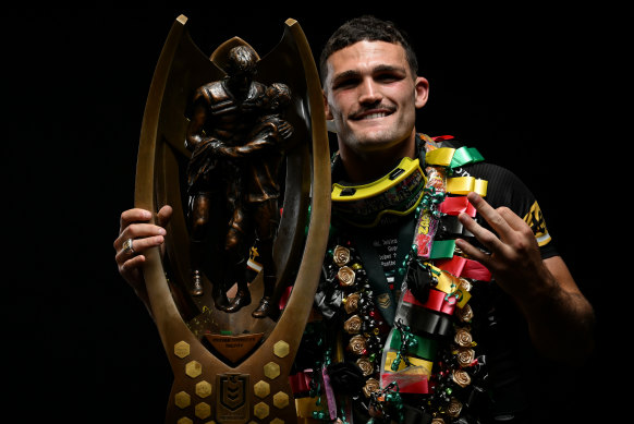 Nathan Cleary poses with the NRL premiership trophy after Penrith’s third straight grand final win.