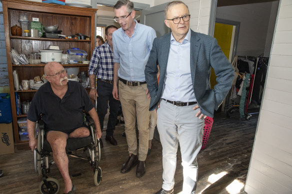Lismore flood victim Brian Burgin gives Prime Minister Anthony Albanese and NSW Premier Dominic Perrottet a tour of his flood ravaged home.