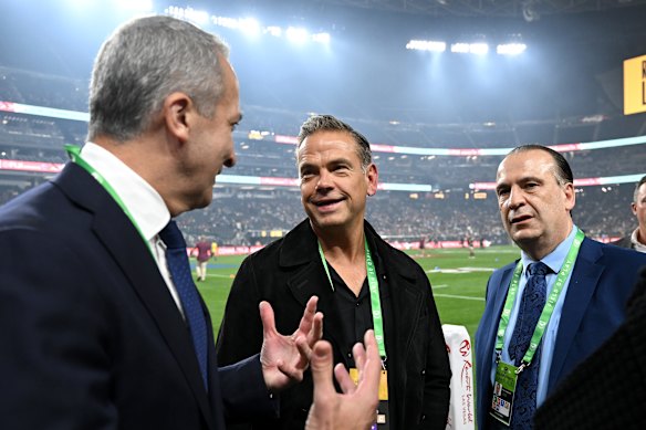 News Corp chair Lachlan Murdoch (centre) and Peter V’landys (right) at the NRL season opener in Las Vegas in 2024.