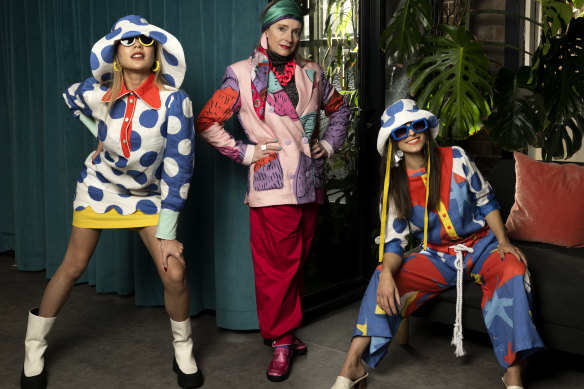 Fashion designer Monika Branagan (centre) with models Shanesse Wong and Tori Michael. 