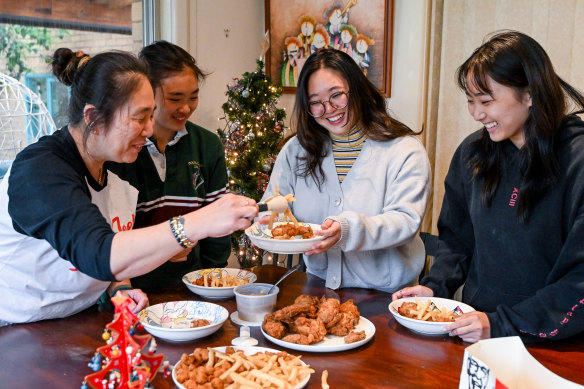 Yumiko Hong (left) with her daughters Himiko, Midori and Ranko. In Japan, serving KFC as a Christmas dinner has been a tradition since the 1970s.