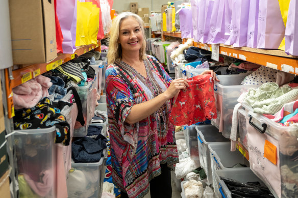 Bursting at the seams: Big Group Hug chief executive Bernadene Voss at the charity’s Bundoora warehouse.