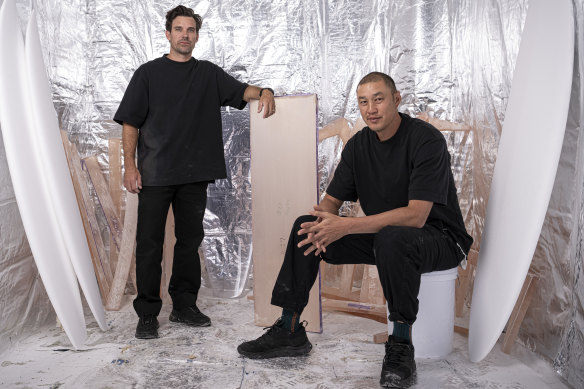 Surfboard maker Hayden Cox (left) and Kelvin Ho, director at architecture firm Akin Atelier in the purpose-built room to post cure the resin panels. 