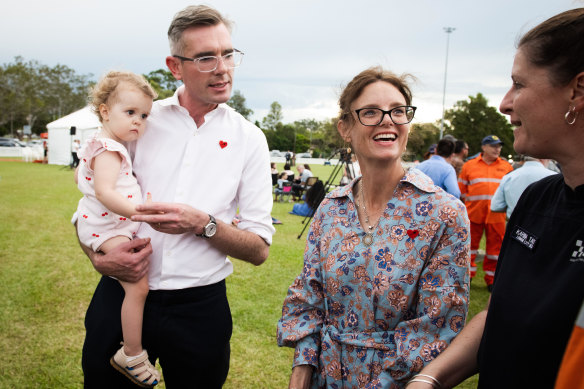 Dominic Perrottet, seen holding Lismore local Adelaide Tait, attended a memorial at Mortimer Park.