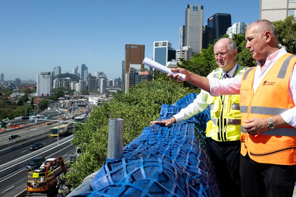 Transport for NSW coordinator general Howard Collins (left) and project director Tony Sheppard looking over the Warringah Freeway at North Sydney.