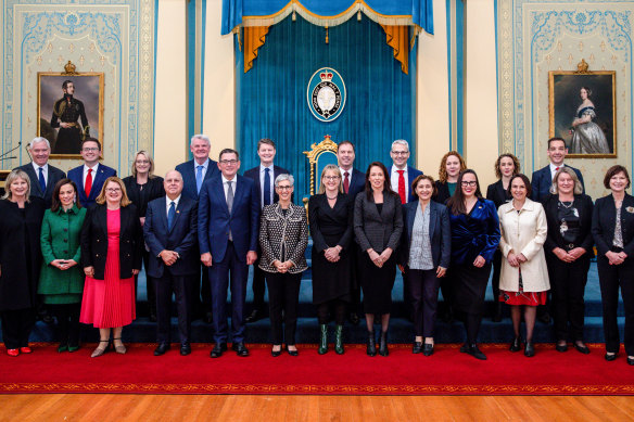 Government members pose for a group photo at Government House during the swearing-in ceremony on Monday.