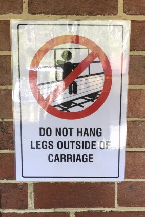 A sign was put up warning passengers not to put their legs outside the carriage. 