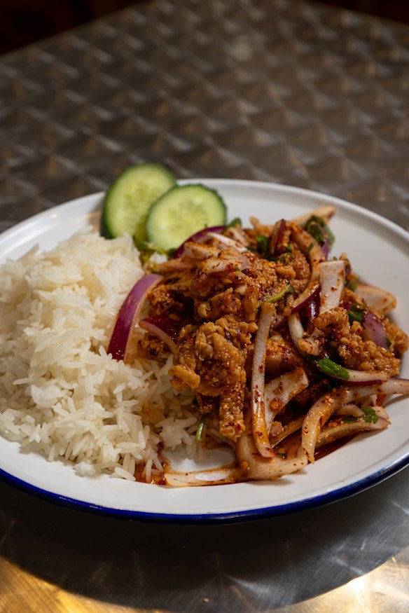 Yum gai zabb with rice (spicy chicken salad).