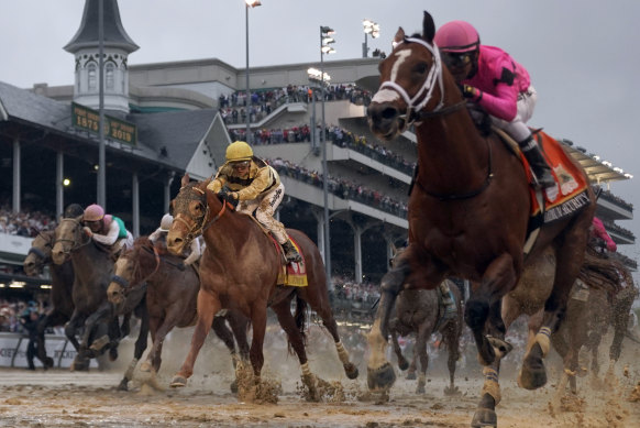 Luis Saez on Maximum Security leads Flavien Prat on Country House in the Kentucky Derby.