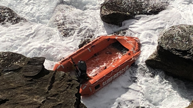 A Surf Lifesaving NSW rescue boat was washed up on to rocks at Gordon's Bay.