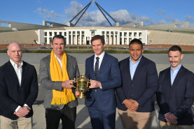 Independent senator David Pocock, Rugby Australia President Joe Roff, ACT Brumbies coach Stephen Larkham Wallaby Allan Alaalatoa and Wallaby Nic White pose with the Webb Ellis Cup.