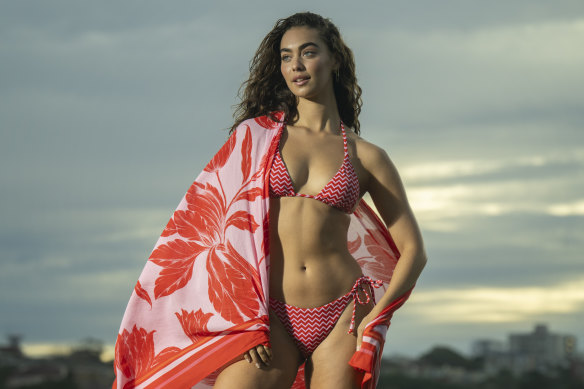 Tash Galgut models Seafolly swimwear on Bondi Beach. Seafolly is expanding with new direct-to-consumer sites in the UK, plus new sites for the US, Australia and Singapore.