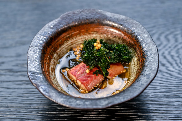 Eel with crisp kale and a smoky black tea broth is based on a home-style dish.