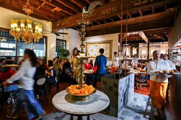 Industrial elements combine with luxe chandeliers at swanky Hopper Joint.