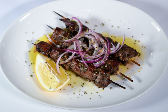 Charcoal grilled lamb skewers with a wedge of lemon, of course.