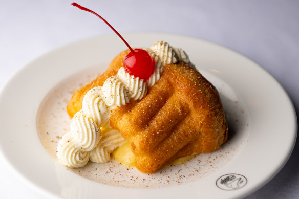 Le Foote’s rum baba with sabayon and maraschino cherry.