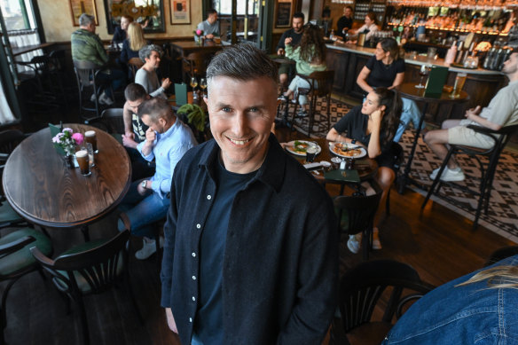Bar owner Liam Ganley in his just-renovated Irish bar, which has remained busy.