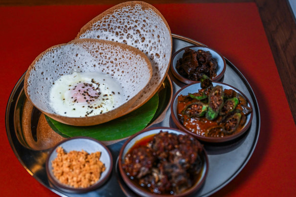 The hopper set offers bowl-shaped rice flour pancakes, two curries and sambols. 