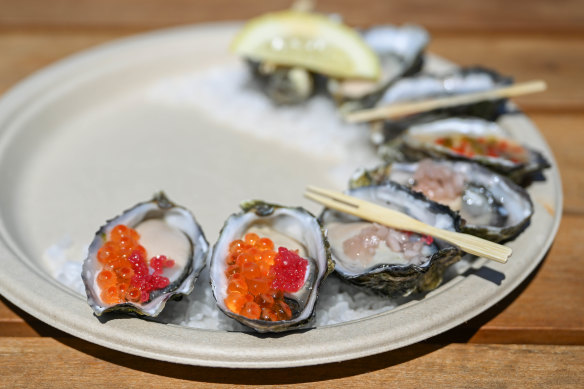 A selection of oysters dressed with Yarra Valley caviar and finger lime; mignonette; nam jim; and natural.