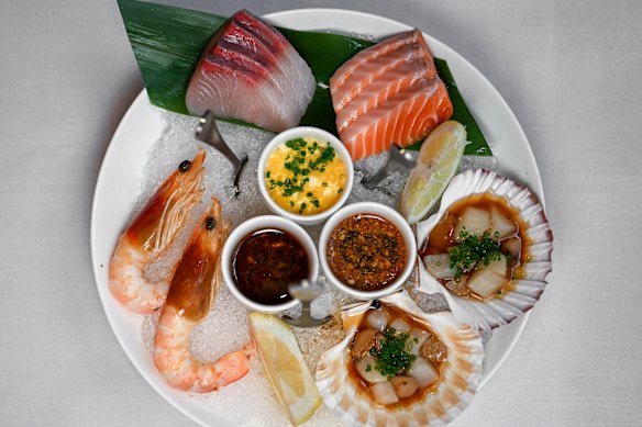 The “Four Dances of the Sea”, pictured at the original Melbourne restaurant, featuring kingfish and trout sashimi; marinated scallops; and razorback prawns.