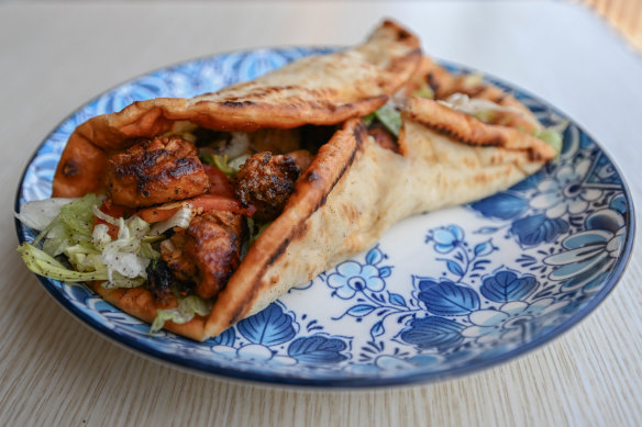 Garlic, ginger and paprika chicken skewers in a wrap.