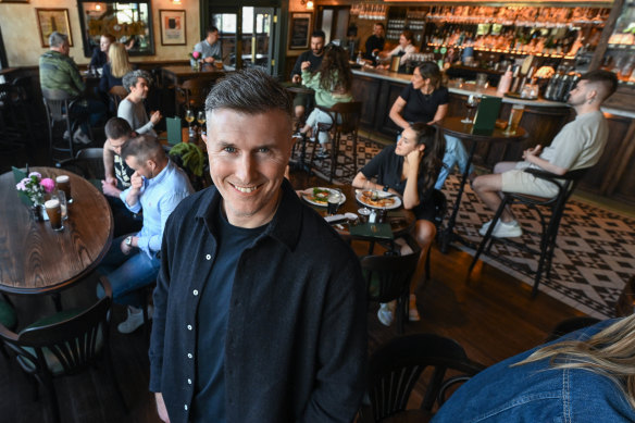 Bar owner Liam Ganley in his just-renovated Irish bar, which has remained busy.