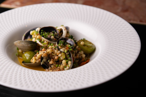 Fregola with clams, calamari and anchovy butter.