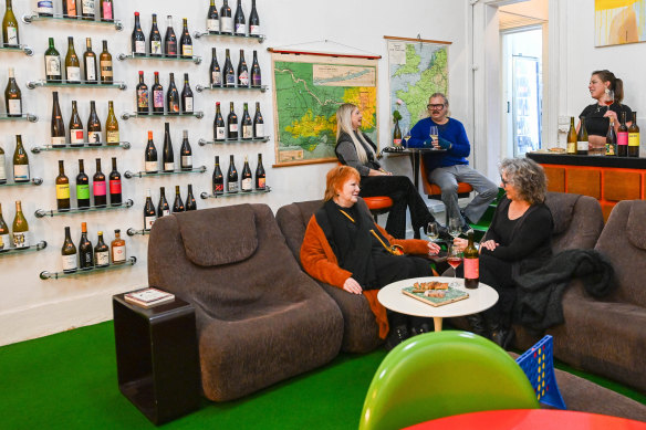 Orange vinyl, green carpet and games such as Connect 4 await at Pour Diane.