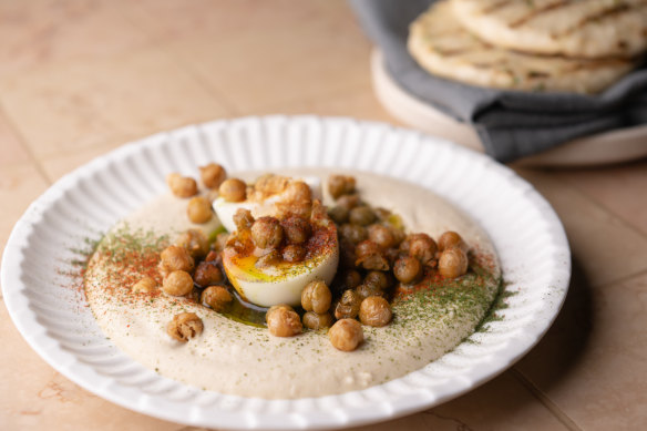 The go-to dish: Hummus with soft-boiled egg, crisp chickpea and flatbread.