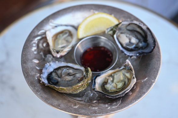 Fat, fresh oysters are served with lemon and a slightly too-sweet mignonette.