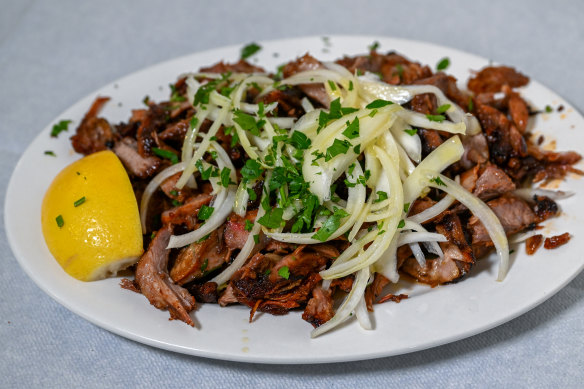Lamb, sliced straight from the gyro and served with raw onion and lemon.